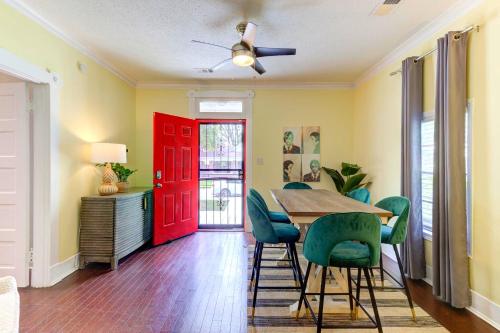 a dining room with a red door and a table and chairs at Spacious 3BR Midtown Home - Sleeps 7 - Walkable to Dining & Attractions - Easy Access to Downtown in Memphis