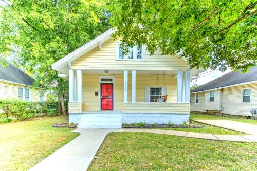 a yellow house with a red door at Spacious 3BR Midtown Home - Sleeps 7 - Walkable to Dining & Attractions - Easy Access to Downtown in Memphis