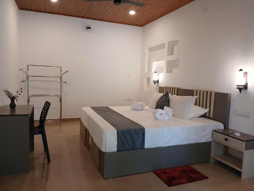 Postel nebo postele na pokoji v ubytování Marari Beach Way Inn