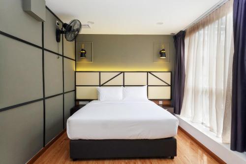 Postel nebo postele na pokoji v ubytování Merits Hotel Cameron Highlands