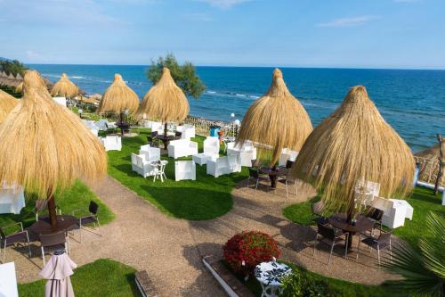 an aerial view of a resort with chairs and umbrellas at Holiday Village in Fondi