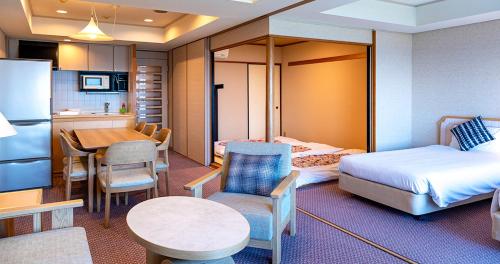 Postel nebo postele na pokoji v ubytování Seagaia Forest Condominiums