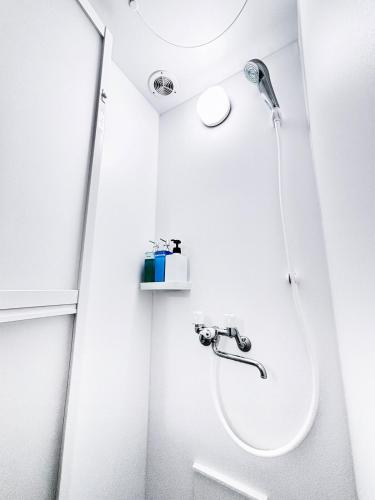 a bathroom with a shower and a sink at Shibuya 10 min Walk Theater & Garden Stay Max 6ppl in Tokyo