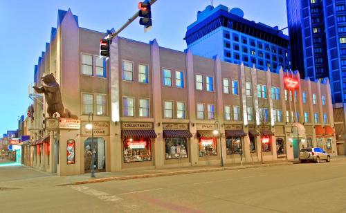 a building on the corner of a street with a traffic light at Historic Anchorage Hotel in Anchorage
