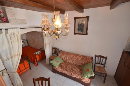 a living room with a couch and a fireplace at I Trulli Di Ottavio in Alberobello