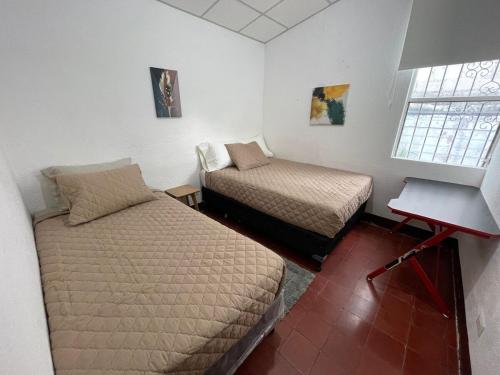 En eller flere senge i et værelse på Casa Lucía