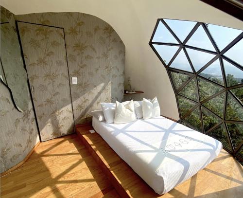 Postel nebo postele na pokoji v ubytování Bosque Geométrico