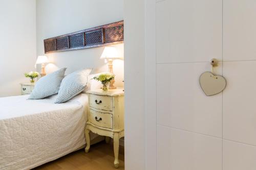 מיטה או מיטות בחדר ב-Sitges Center Apartment