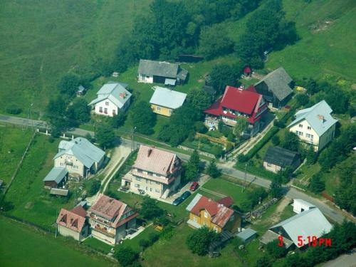 an aerial view of a house in a village at Willa pod Babkami in Tylicz