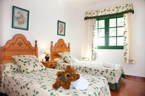Tempat tidur dalam kamar di Villas Bocaina Beach