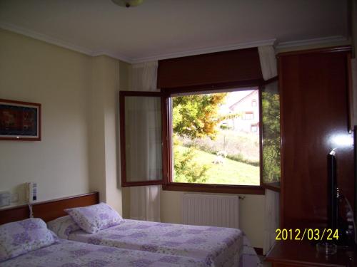 Postel nebo postele na pokoji v ubytování Hotel Noray