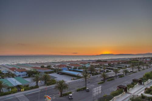 an aerial view of a city at sunset at Hotel Bixio in Lido di Camaiore