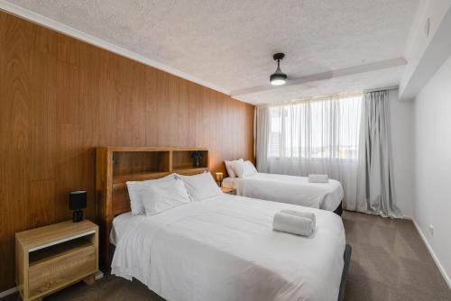 Ένα ή περισσότερα κρεβάτια σε δωμάτιο στο Stylish CBD Escape, Walk to Cafes and Shops!