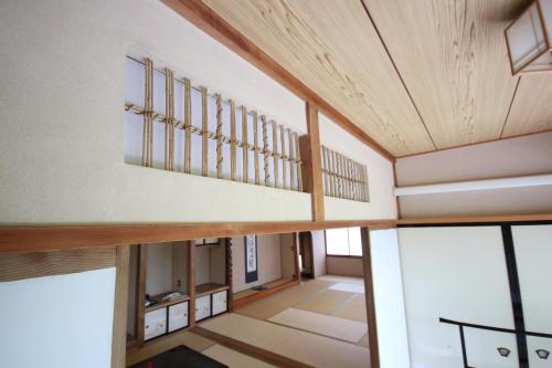 Postel nebo postele na pokoji v ubytování 塵表閣本店