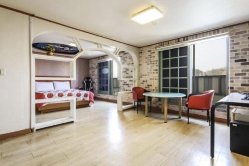 Postel nebo postele na pokoji v ubytování Gunsan Eldorado