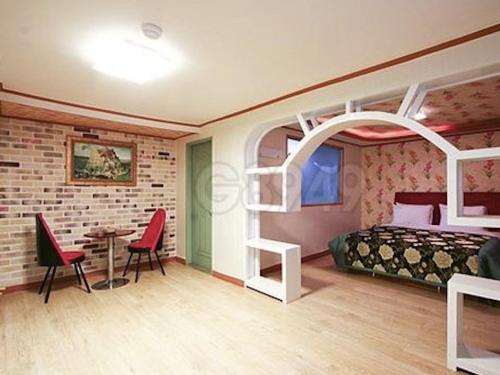 Postel nebo postele na pokoji v ubytování Gunsan Eldorado