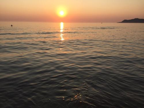 a sunset over the water with the sun setting at Sunrise Hotel Cameria in Durrës