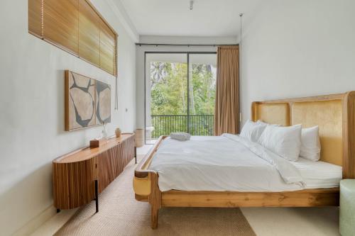 En eller flere senge i et værelse på Casa Blanca Villa