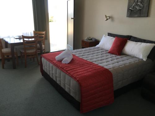 Postel nebo postele na pokoji v ubytování Ascot Oamaru Motel