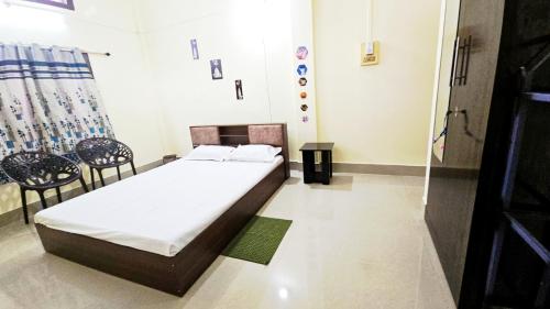 Postel nebo postele na pokoji v ubytování Tomato home stay