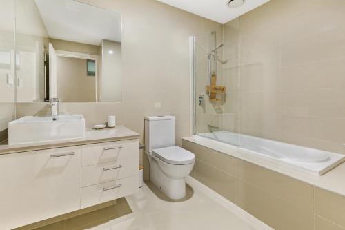 a bathroom with a toilet and a sink and a shower at Salt 13 Luxury Apartment in Sorrento