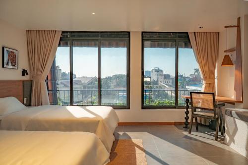 Ένα ή περισσότερα κρεβάτια σε δωμάτιο στο Than Coffee & Homestay