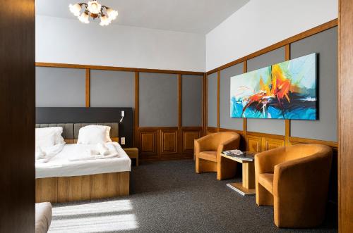 Ένα ή περισσότερα κρεβάτια σε δωμάτιο στο Svájci Lak Panzió