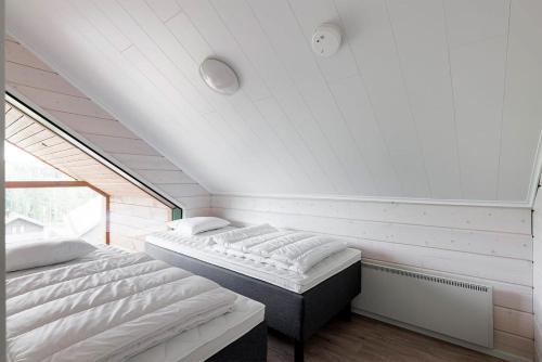 Postel nebo postele na pokoji v ubytování Villa Luxus Helmi 2 - 23 hlö, Golf Resort