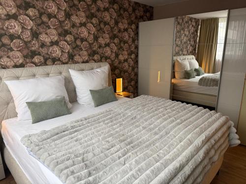 En eller flere senge i et værelse på Suite Bellevue