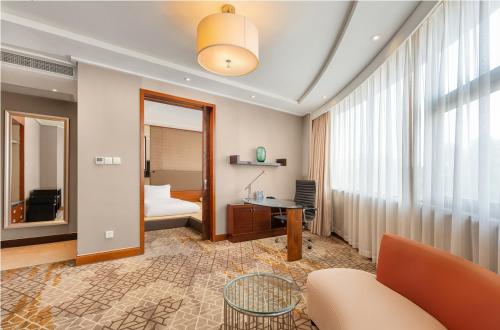 Ένα ή περισσότερα κρεβάτια σε δωμάτιο στο Arula Plaza Shanghai