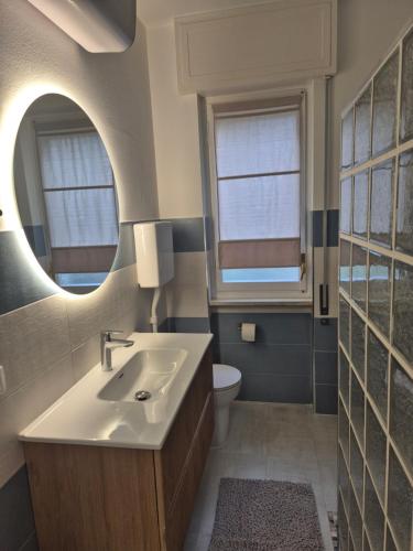 a bathroom with a sink and a toilet at Casa Sabina in Sanremo