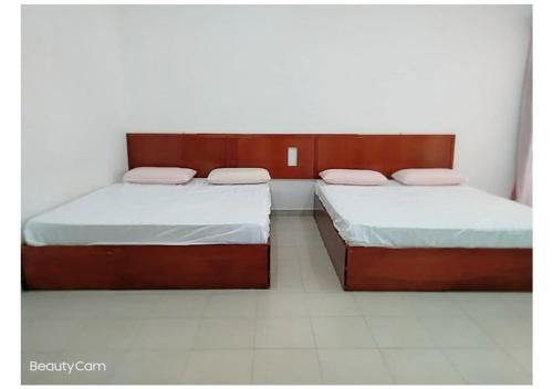 Una cama o camas en una habitación de Pangkor Villa Jia Yuan 邦咯岛家苑海滩别墅