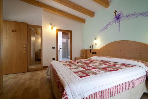 Postel nebo postele na pokoji v ubytování Hotel Sport