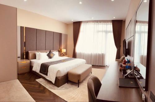 Ένα ή περισσότερα κρεβάτια σε δωμάτιο στο HAO LAN LUXURY Hotel