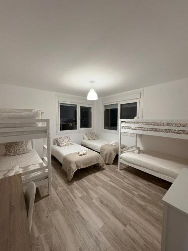 En eller flere senge i et værelse på Villa Ikigai Costa