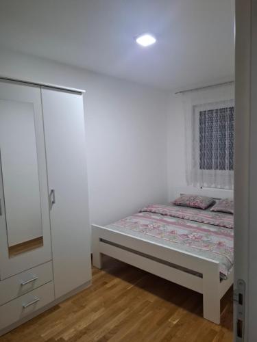 Кровать или кровати в номере Apartman Bulevar