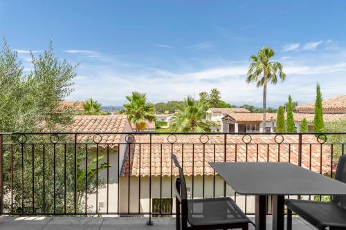 a view of a balcony with a table and chairs at Villa Cosy, hotel & spa in Saint-Tropez