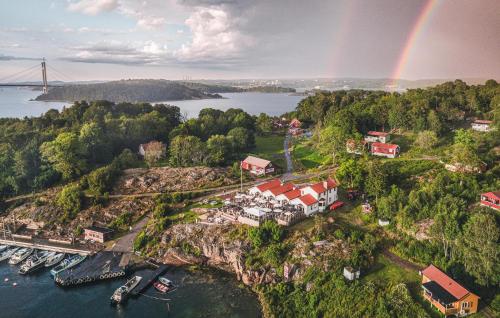 an aerial view of a town with a rainbow at Cozy Home In Myggenäs With Sauna in Höviksnäs