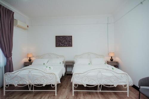 Ένα ή περισσότερα κρεβάτια σε δωμάτιο στο Pandan Inn Boutique Hotel