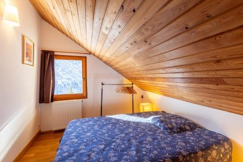 Ένα ή περισσότερα κρεβάτια σε δωμάτιο στο L'Alpazen