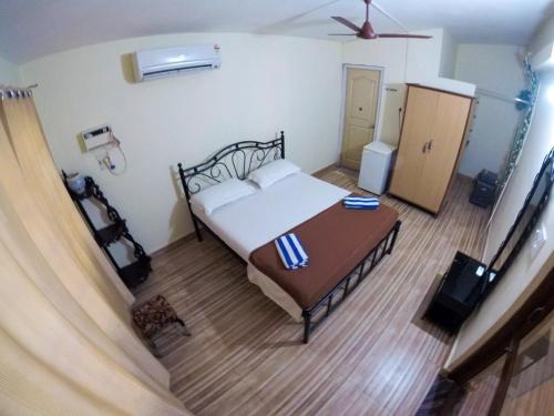 En eller flere senge i et værelse på Palm view inn