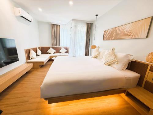 TV a/nebo společenská místnost v ubytování Wyndham Garden Samui Wing