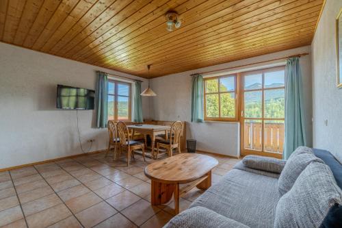 a living room with a couch and a table at Lohberg Apartment in Lohberg