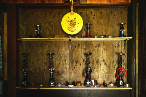 a wooden wall with two shelves with different items on it at Minamikoma-gun - House - Vacation STAY 19040 in Kajikazawa