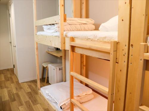 Un pat sau paturi într-o cameră la RetroSpect Stay Yokohama - Vacation STAY 93126v