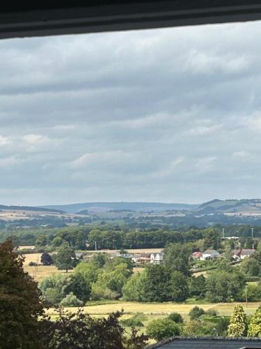 a view of a field from a window at The Cwtch in Ludlow