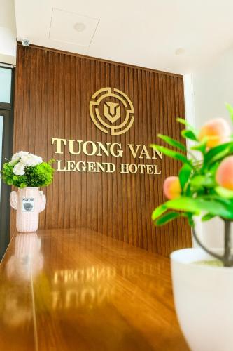 a sign for a long van international hotel on a wall at Tường Vân Legend Hotel in Cao Bằng