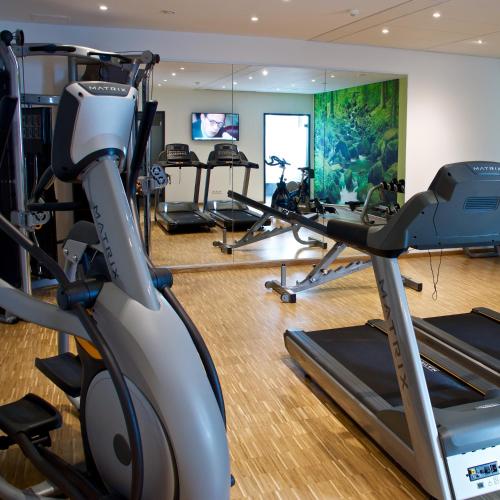 a gym with several tread machines and a treadmill at Arcadeon in Hagen