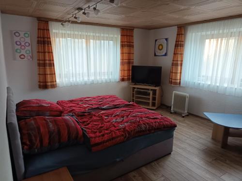 Кровать или кровати в номере Ferienappartement am Bauernhof