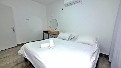 Postel nebo postele na pokoji v ubytování אחוזת חושן